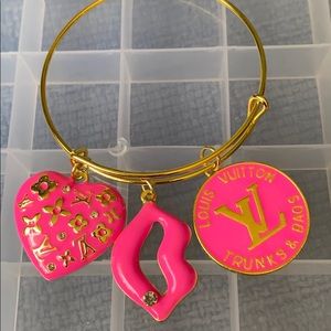 Gold plated bangle with charms